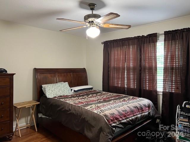 bedroom featuring ceiling fan and wood-type flooring