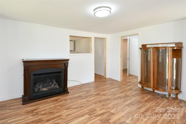 unfurnished living room with light hardwood / wood-style flooring