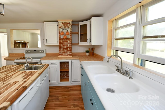 kitchen featuring white cabinetry, dishwasher, sink, wine cooler, and range