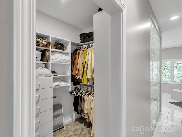 spacious closet featuring light tile patterned floors