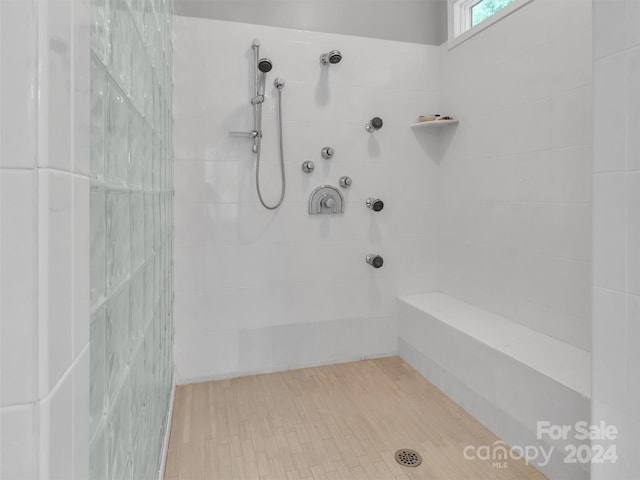 bathroom with tiled shower