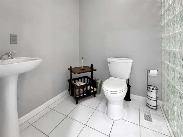 bathroom featuring toilet and tile patterned floors