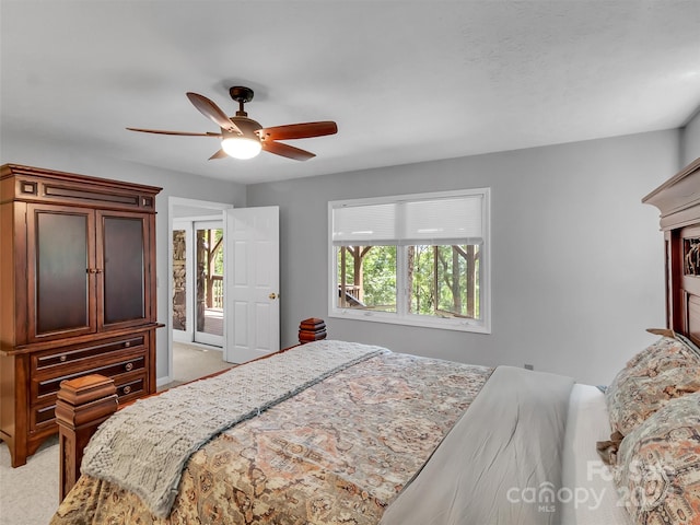 bedroom with ceiling fan and light colored carpet