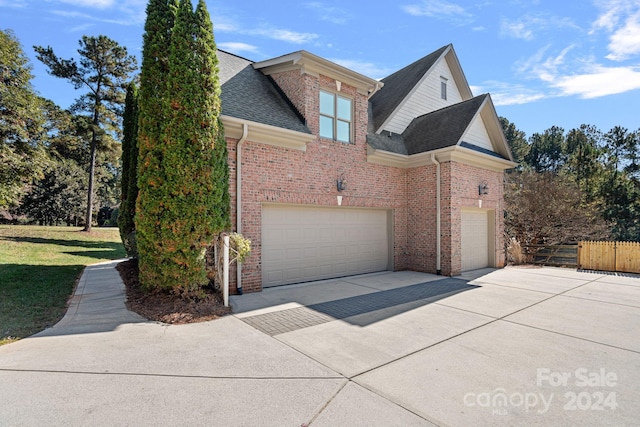 view of side of property featuring a garage