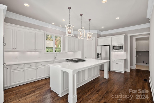 kitchen featuring a center island, white cabinets, stainless steel appliances, and dark hardwood / wood-style floors