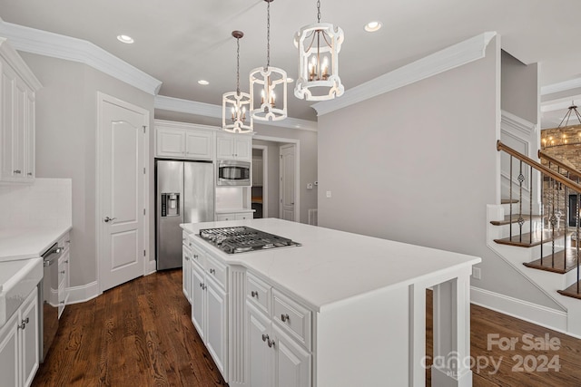 kitchen featuring stainless steel appliances, pendant lighting, white cabinetry, dark hardwood / wood-style floors, and a kitchen island