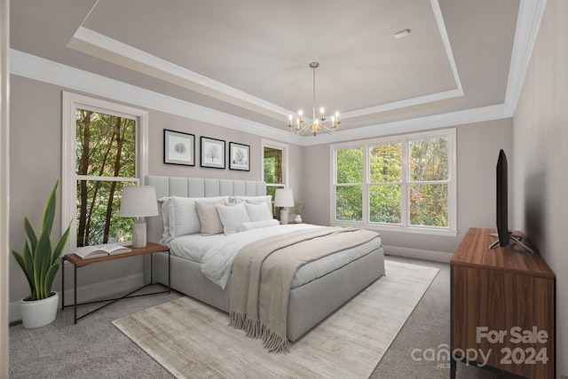 carpeted bedroom featuring a tray ceiling, an inviting chandelier, and ornamental molding