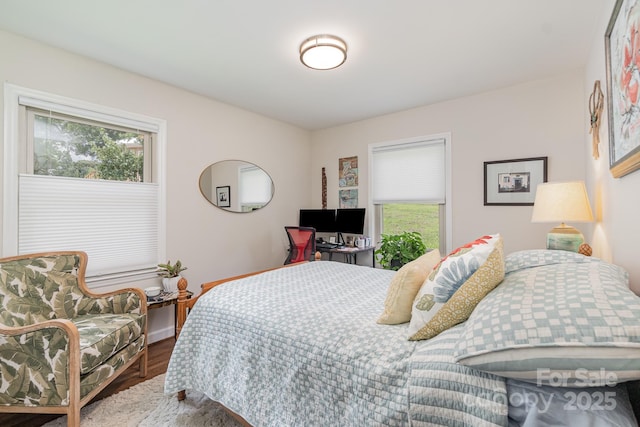 bedroom featuring wood finished floors