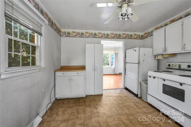 kitchen featuring ceiling fan, white appliances, and white cabinets