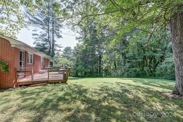 view of yard featuring a wooden deck