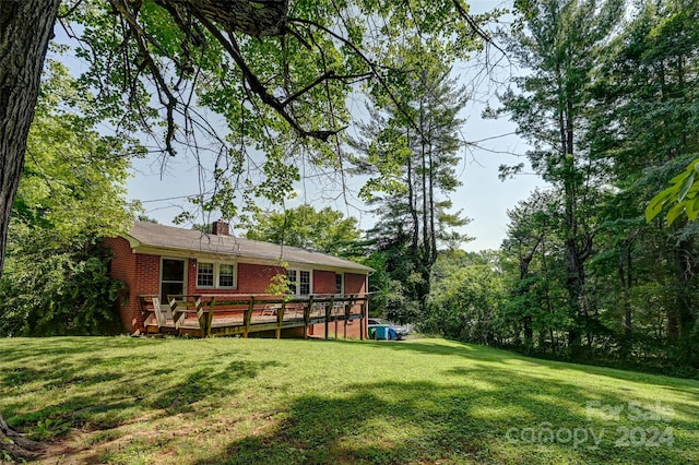 view of yard featuring a deck