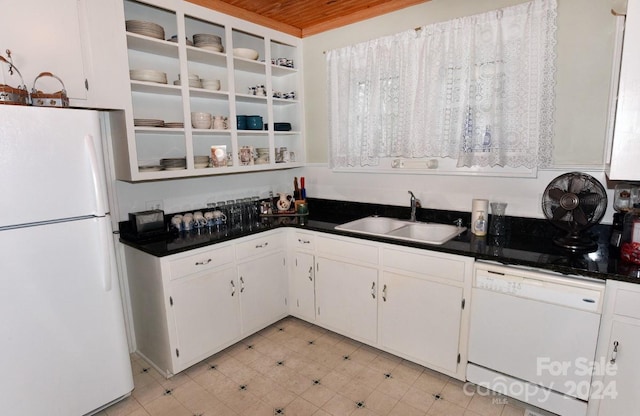 kitchen with sink, wood ceiling, light tile patterned floors, and white appliances