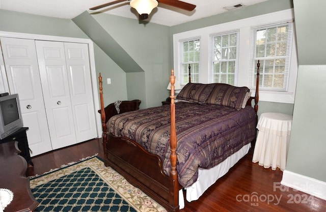 bedroom with vaulted ceiling, ceiling fan, hardwood / wood-style floors, and a closet