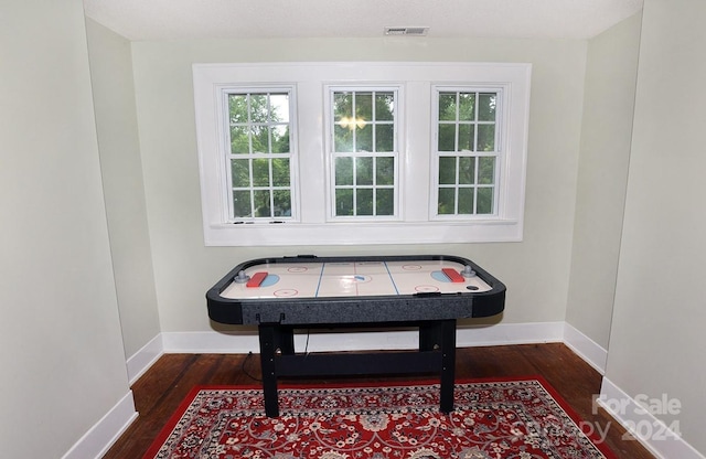 miscellaneous room featuring dark hardwood / wood-style flooring