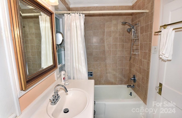 bathroom with ornamental molding, vanity, and shower / tub combo