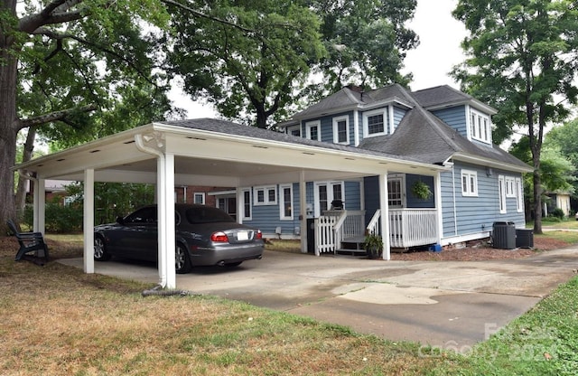 exterior space with a carport, a porch, and cooling unit