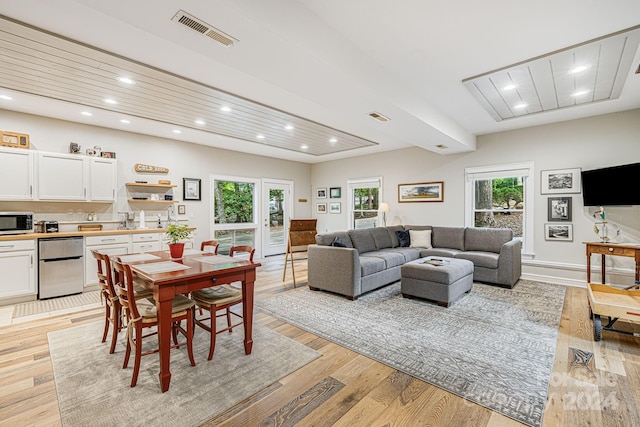 dining area with recessed lighting, visible vents, french doors, and light wood finished floors