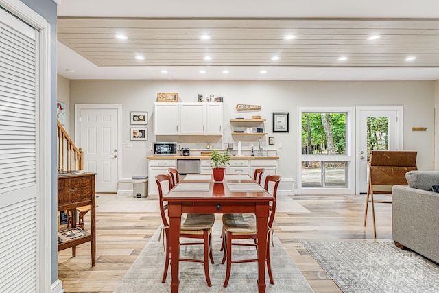 dining room with recessed lighting, wooden ceiling, baseboards, and light wood-style floors