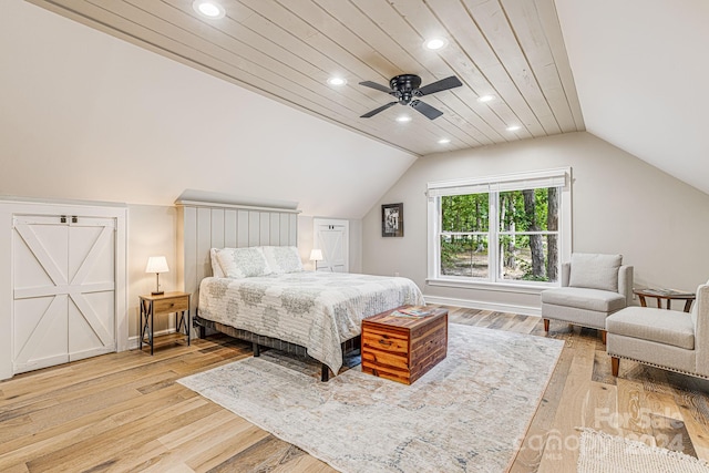 bedroom featuring recessed lighting, light wood-style flooring, and vaulted ceiling