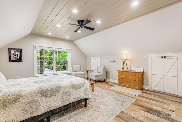 bedroom with ceiling fan, baseboards, vaulted ceiling, recessed lighting, and wood finished floors