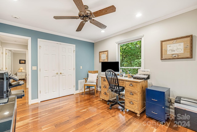 office space with light wood-style flooring, a ceiling fan, crown molding, and baseboards