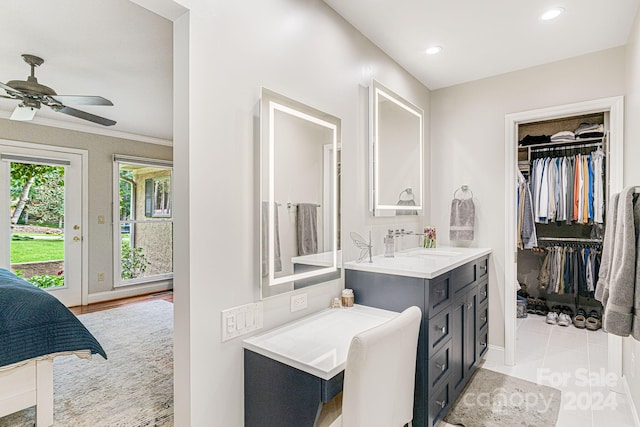 bathroom featuring vanity, a spacious closet, recessed lighting, and a ceiling fan