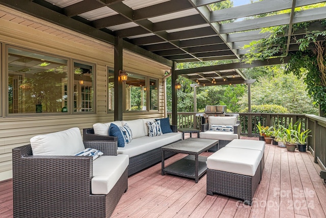 wooden deck with an outdoor living space and a pergola