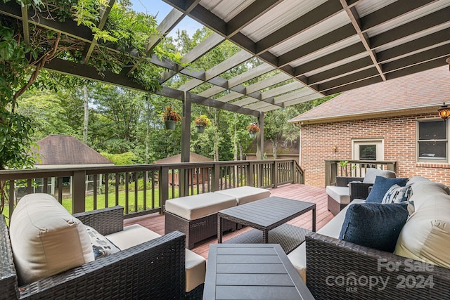 deck with a pergola and an outdoor hangout area