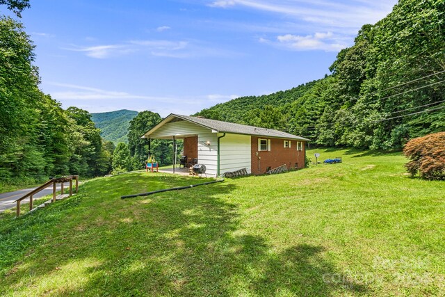 view of home's exterior featuring a yard