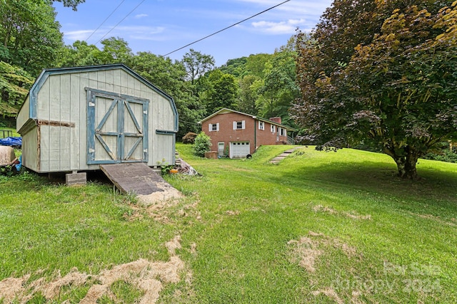 view of outdoor structure featuring a lawn