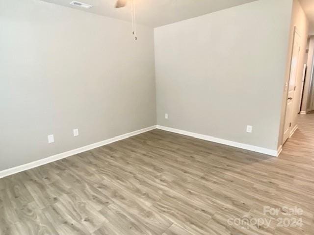 unfurnished room featuring wood-type flooring