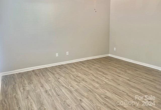 unfurnished room featuring light hardwood / wood-style flooring