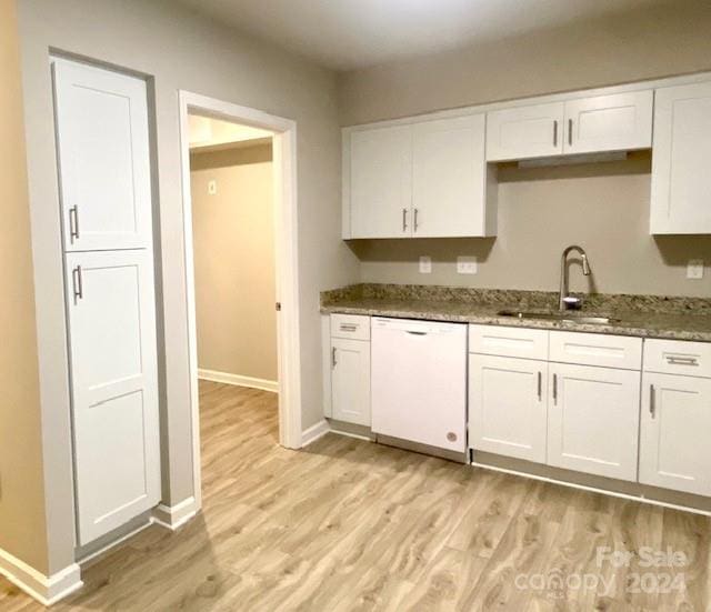 kitchen featuring dark stone counters, white cabinetry, light hardwood / wood-style floors, and dishwasher