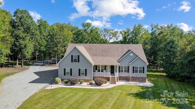 view of front of house with covered porch and a front yard