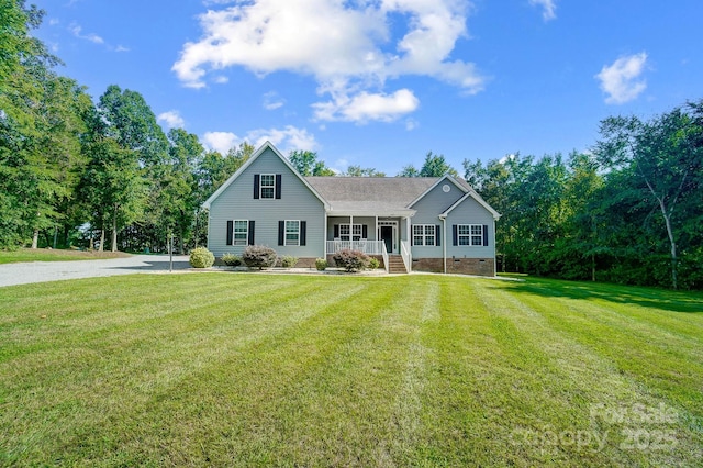 view of front of house featuring a front yard, crawl space, covered porch, and driveway