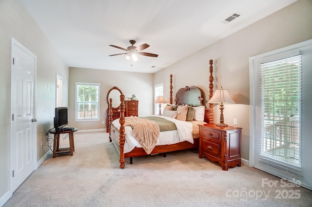 bedroom featuring light carpet, ceiling fan, visible vents, and access to outside