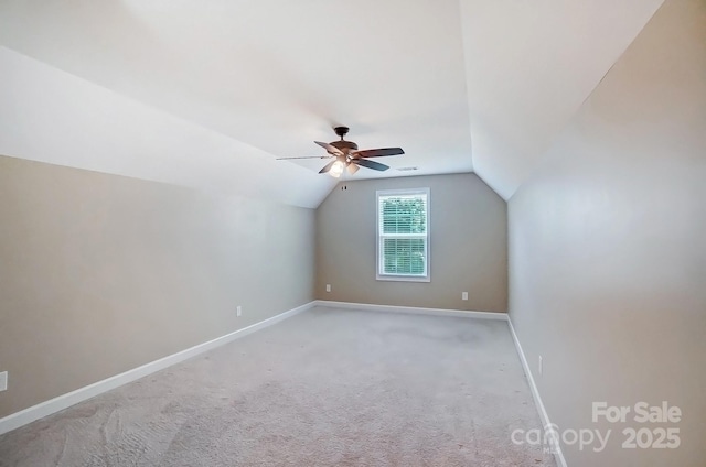 bonus room with light carpet, baseboards, a ceiling fan, and lofted ceiling