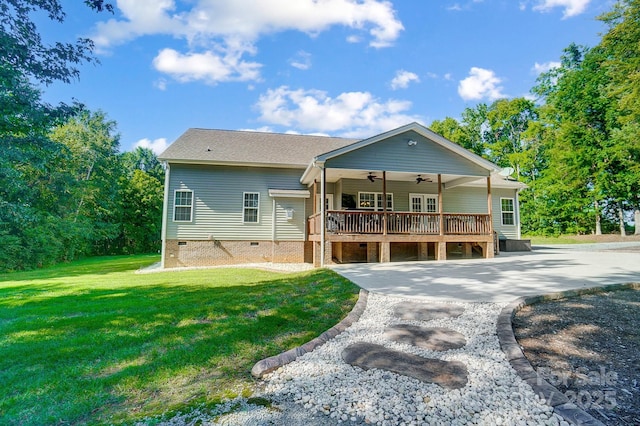 view of front of home with ceiling fan, a front lawn, crawl space, and a wooden deck