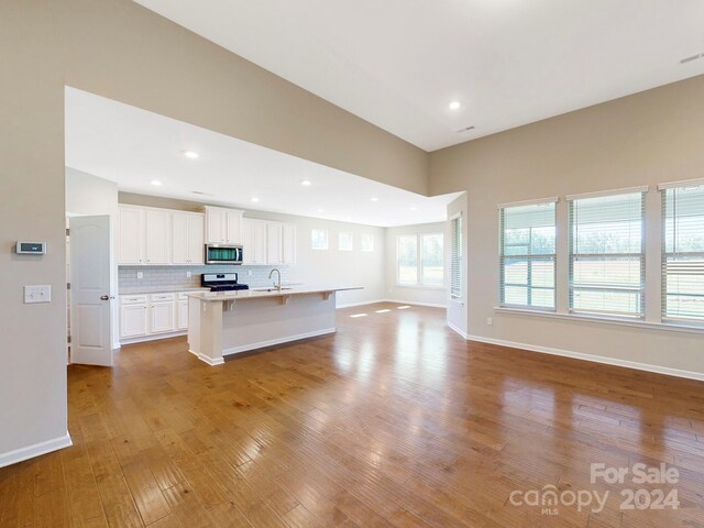 7025 Stella Pl, Stanley, NC 28164 - unfurnished living room featuring light wood-type flooring and recessed lighting