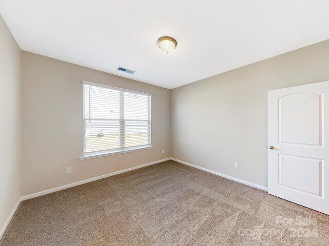 7025 Stella Pl, Stanley, NC 28164 - spare room with carpet floors and baseboards