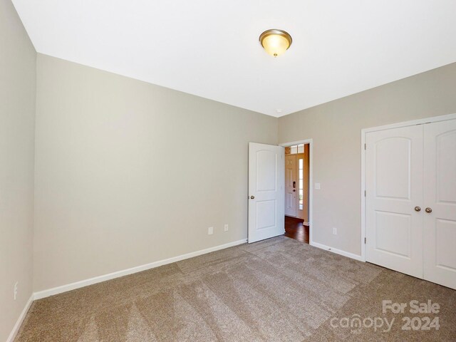7025 Stella Pl, Stanley, NC 28164 - unfurnished bedroom with carpet and a closet
