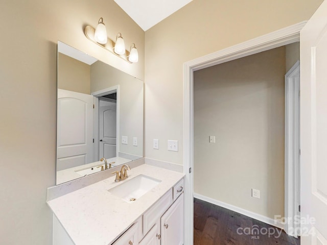 bathroom featuring hardwood / wood-style floors and vanity