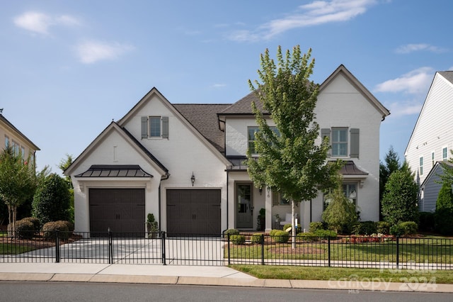 view of front facade with a garage and a front yard