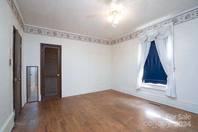 empty room featuring hardwood / wood-style flooring and ceiling fan