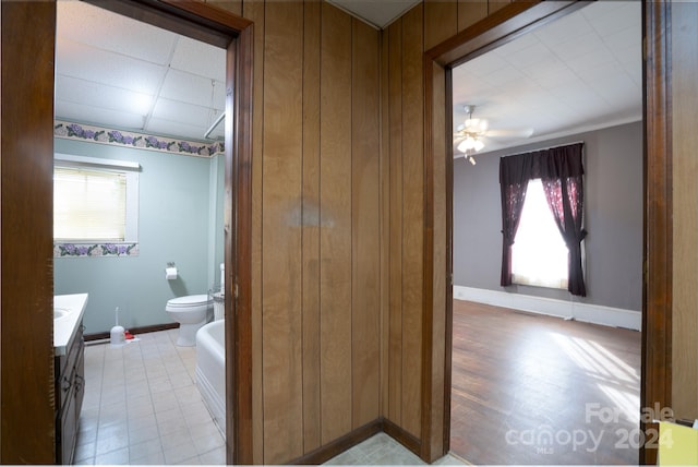 bathroom with vanity, toilet, tile patterned floors, and ceiling fan