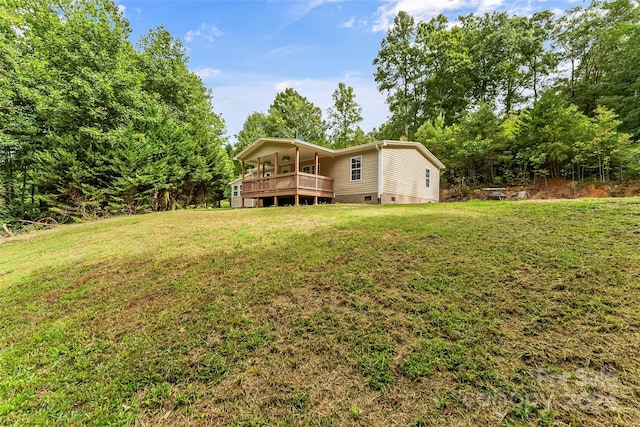 view of yard featuring a wooden deck