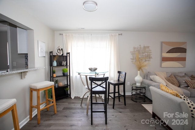 dining space featuring dark hardwood / wood-style floors