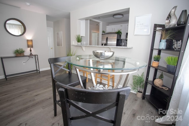 dining room featuring dark hardwood / wood-style flooring