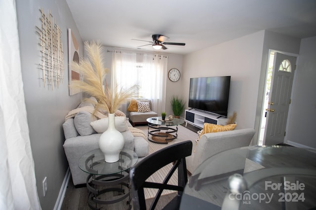 living room with ceiling fan and hardwood / wood-style floors