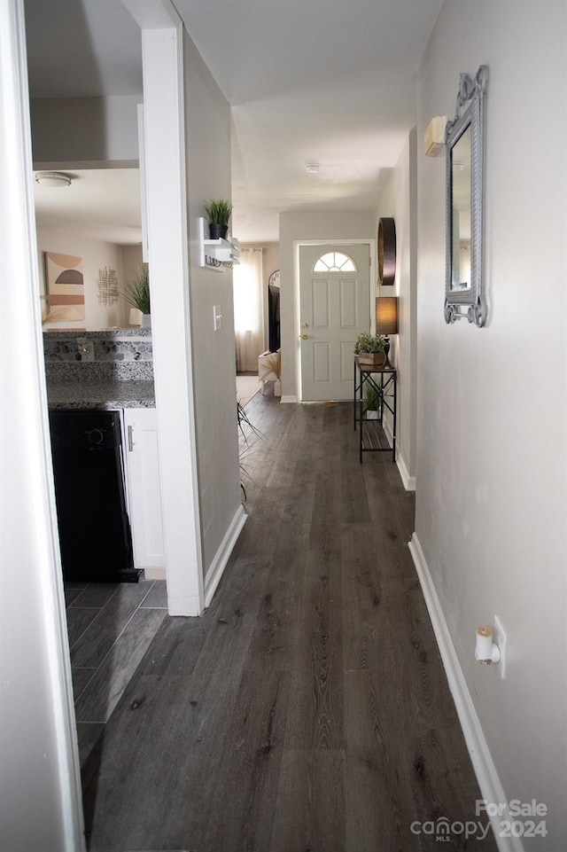 corridor featuring dark hardwood / wood-style flooring